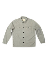 The BGpontus Teo Overshirt by Blue de Gênes in Shadow Green features a relaxed fit, long sleeves, collar, and two button-flap chest pockets. It's shown neatly laid flat on a white background.