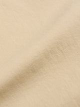 Close-up of BGpalco Rodas Pants in Pale Khaki by Blue de Gênes, showing the soft, subtly textured fabric and gentle folds with a smooth matte finish, perfect for relaxed regular fit chinos.