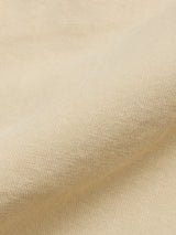 Close-up of the BGcopple Rodas Shorts in Pale Khaki by Blue de Gênes, featuring a soft cotton hemp blend fabric with a textured weave, natural folds, and subtle shadows and highlights.