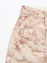 Close-up of BGcupra Print Shorts - Multi Pattern by Blue de Gênes, featuring a wide fit with beige and brown desert camo, showing waistband, belt loop, side pocket, and part of the leg on a white background.