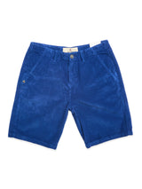 The Blue de Gênes BGfloyd Cord Shorts in Navy Peony feature a loose fit, front pockets, button and zip closure, and a small gold emblem on the left pocket, shown laid flat on a white background.
