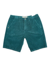 The BGfloyd Cord Shorts - Green Harvest by Blue de Gênes are loose fit, teal green garment-dyed cotton corduroy shorts with side pockets, button and zipper closure, plus a small embroidered logo on the left pocket for effortless style and comfort.