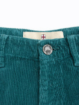 Close-up of BGfloyd Cord Shorts - Green Harvest by Blue de Gênes, featuring a cotton corduroy waistband, metal button, belt loops, and an inner label. Garment dyed for rich color and unique character.