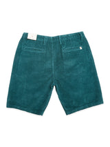 BGfloyd Cord Shorts - Green Harvest by Blue de Gênes: teal loose fit cotton corduroy shorts with two back pockets and a white tag on the waistband, shown flat on a white background.