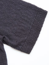 Close-up of the sleeve of the Blue de Gênes BGjohn Slubby Polo in Dark Navy, showing textured slubby cotton knit and ribbed cuff detail, laid flat on a white background.