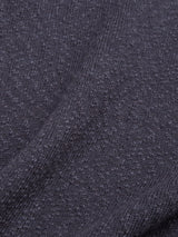 Close-up of Blue de Gênes BGjohn Slubby Polo in Dark Navy shows textured fabric with a visible weave and subtle folds, casting soft shadows that highlight its slubby, cotton-knit appearance.