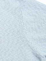 Close-up of the BGjohn Slubby Polo in Blue Fog by Blue de Gênes, showing fine, even stitches and a visible seam—evoking vintage leisurewear and classic craftsmanship.