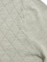 Close-up of the BGwally Diamond Polo in Shadow Green by Blue de Gênes, featuring light grey cotton-linen blend fabric with a diamond-knit pattern and visible seam stitching.