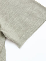 Close-up of the short sleeve of the Blue de Gênes BGwally Diamond Polo in Shadow Green, highlighting its soft cotton-linen knit and subtle zigzag edging. Set against a plain white background.