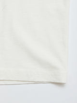 Close-up of the bottom edge of the Blue de Gênes BGoscar T-Shirt - Snow Fall, a plain white 100% cotton crewneck, showcasing fabric texture, stitching, and hem details against a white background.