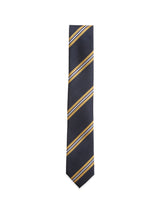 The BGponsy Tie - Dark Navy by Blue de Gênes features diagonal yellow and white stripes on navy blue silk, making it a classic men's necktie. Displayed against a plain white background.