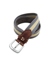 The Blue de Gênes BGcollege Belt - Green Stripe features webbing with green stripes, leather detailing including a brown tip with stitched cross detail, and a silver rectangular buckle.