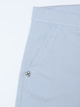 The BGmenzino Vecchio Shorts - Blue Fog by Blue de Gênes are light blue casual fit chino shorts, featuring a visible front pocket with a small metal emblem and belt loop. Made from lightweight cotton for a smooth, comfortable feel.