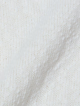 Close-up of the BGjohn Slubby Polo in Chalk by Blue de Gênes—textured, off-white knit with a soft, raised pattern and visible stitches for a cozy, vintage-inspired look.