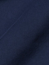 Close-up of the BGhunter Vecchio Jacket in Dark Navy by Blue de Gênes, highlighting its soft cotton stretch fabric with a smooth texture, fine woven fibers, subtle folds, and gentle shadows.
