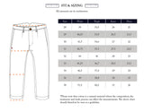 Diagram of Blue de Gênes Kibishi Solid Pant - Dark Navy shows measurement lines at the waistband, thigh, knee, and hem. Beside it, a size chart lists waist, thigh, knee, and hem in centimeters for sizes 28 to 38.