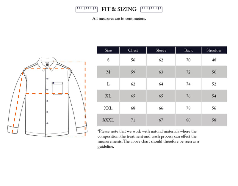 A size chart in centimeters for the Manga Overshirt - Black Pattern by Blue de Gênes, with a measuring guide for chest, sleeve, back, and shoulder. Available in sizes S to XXXL with detailed fit measurements.