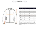 A size chart for the Sakura Knit Cardigan - Stone by Blue de Gênes features an illustrated guide to measuring chest, sleeve, and back in centimeters—ideal for finding your perfect fit from sizes S to XXXL.