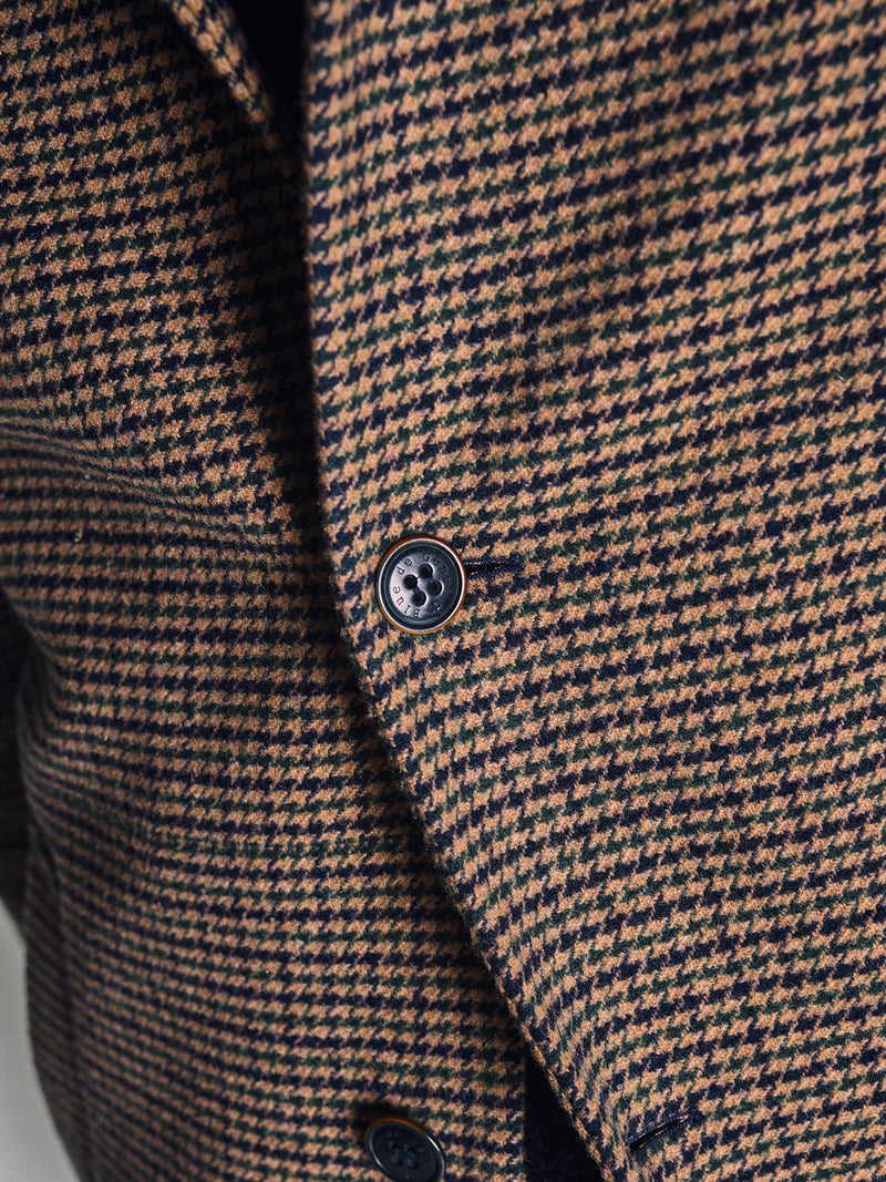 Close-up of the Blue de Gênes Massone Check Coat in a brown and black multi-check pattern, crafted from soft Melton wool with two buttons—showcasing its rich texture and stylish appeal for winter.