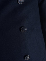 Close-up of the Shiba Melton Coat - Dark Navy by Blue de Gênes, crafted from Italian Melton wool with three large black buttons vertically down the front.