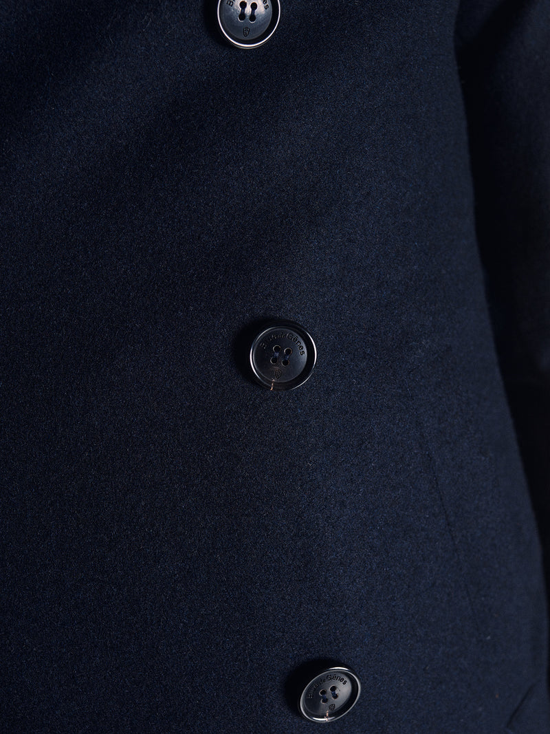 Close-up of the Shiba Melton Coat - Dark Navy by Blue de Gênes, crafted from Italian Melton wool with three large black buttons vertically down the front.