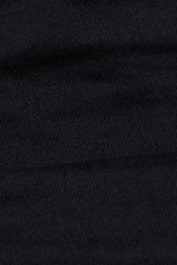 Close-up of Blue de Gênes Repi 3325 Black Jeans, showcasing the durable black denim fabric with visible weave texture and soft folds that create subtle shadows.